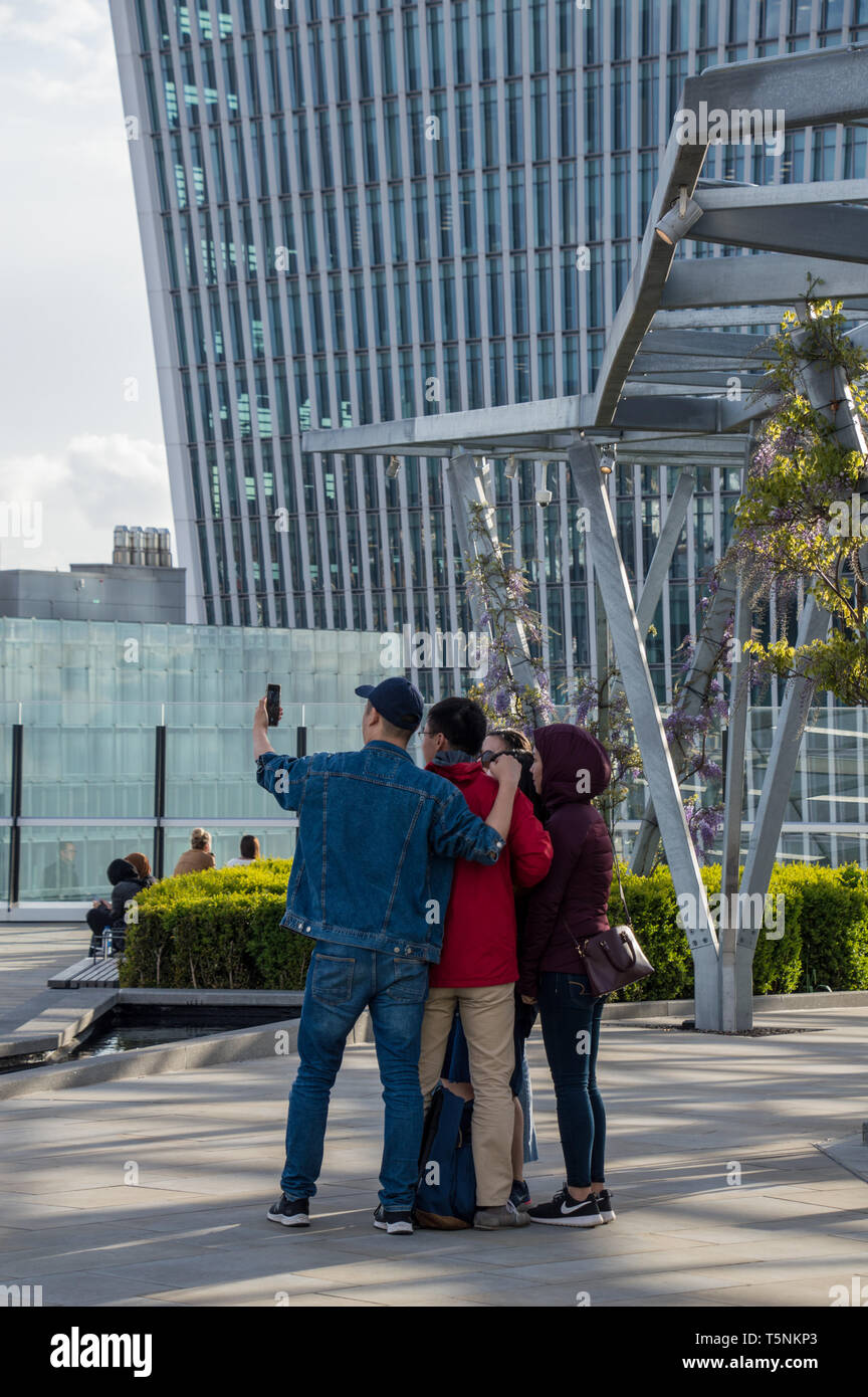Visitors to the Fen court enjoying the views and taking pictures and selfies on the rooftop garden Stock Photo