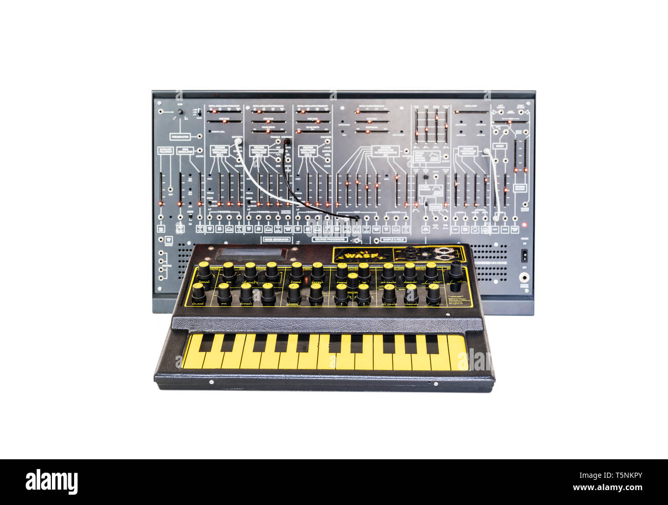 Two Synthesizers. EDP Wasp from 1978 and a modern clone of the Arp 2600 from 1971 with patch cables, in an analog music recording studio. Stock Photo