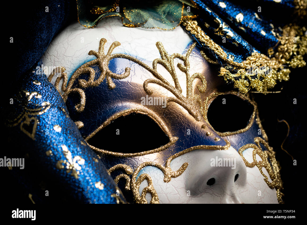 Close up of a blue with gold elegant traditional venetian mask over ...