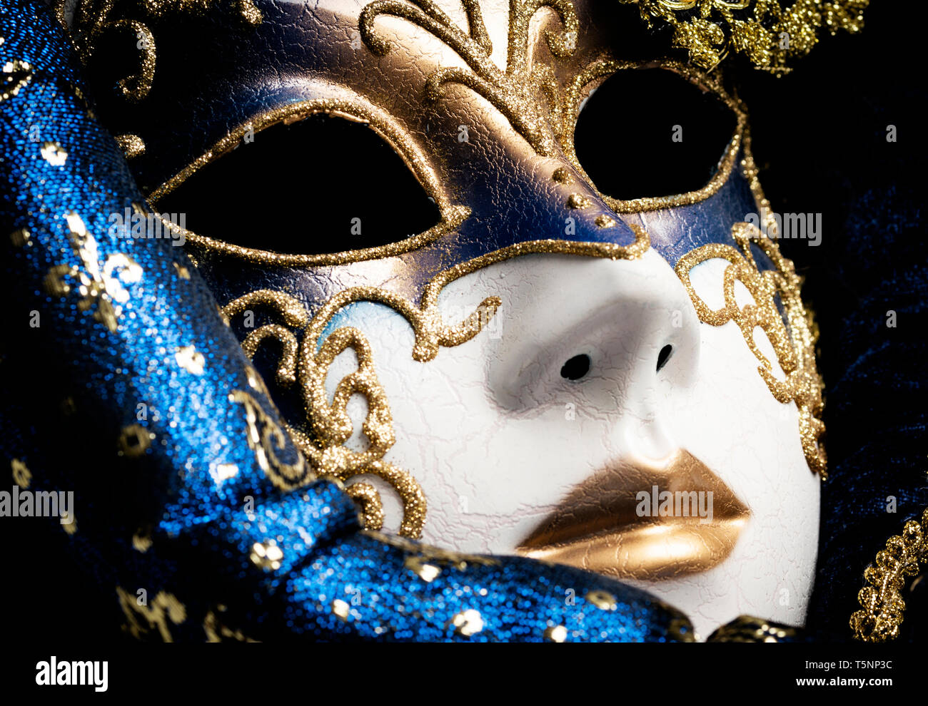 Close up of a blue with gold elegant traditional venetian mask over ...