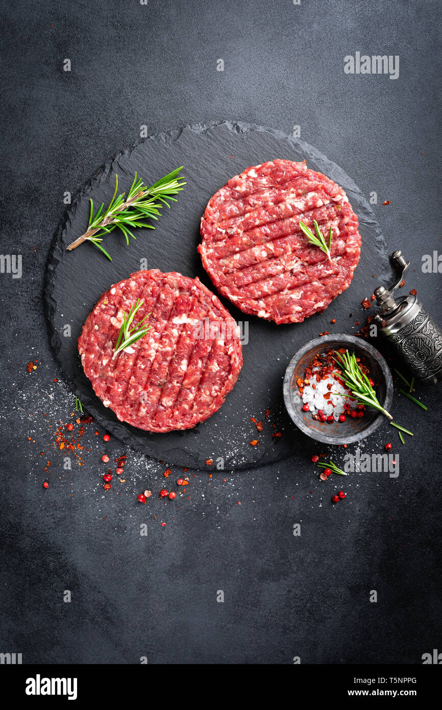 Fresh raw minced beef steak burgers with spices Stock Photo Alamy