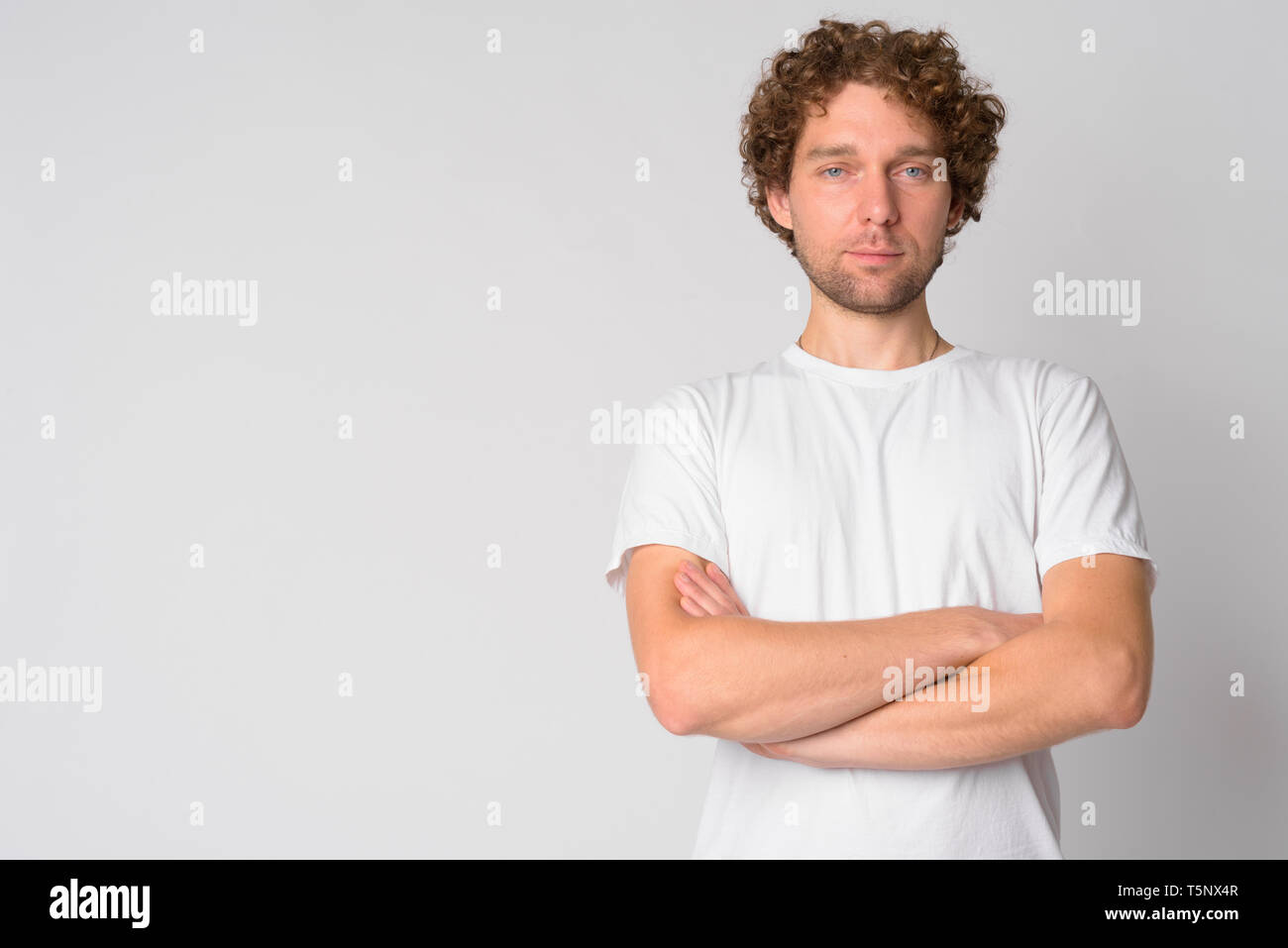 Man curly hair beard crossing hi-res stock photography and images - Alamy