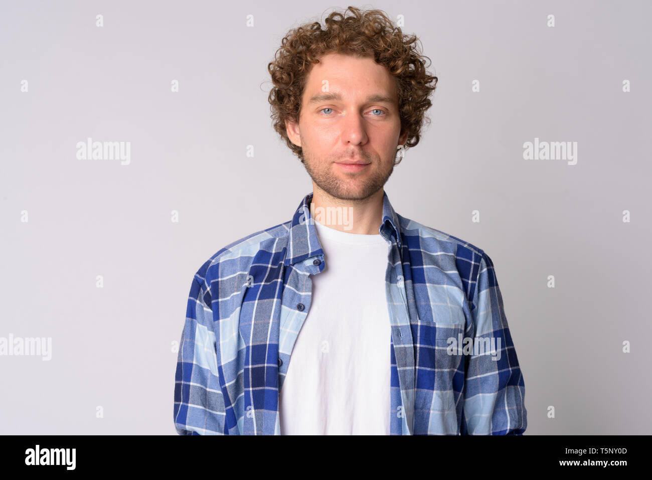 Portrait Of Handsome Hipster Man With Curly Hair Stock Photo