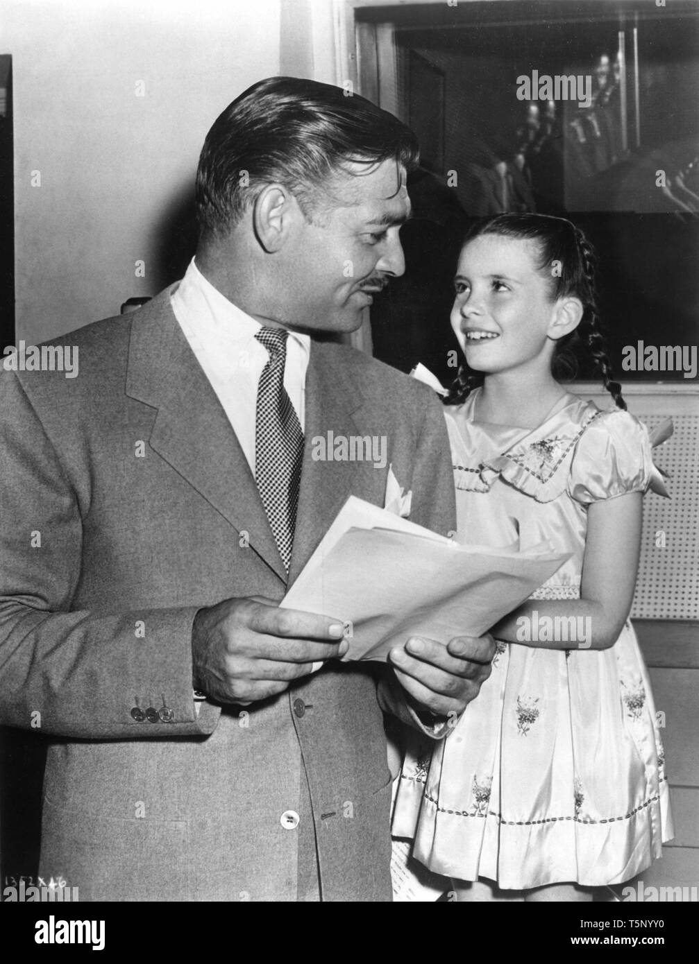 CLARK GABLE and MARGARET O'BRIEN candid on set ADVENTURE 1945 director Victor Fleming Metro Goldwyn Mayer Stock Photo