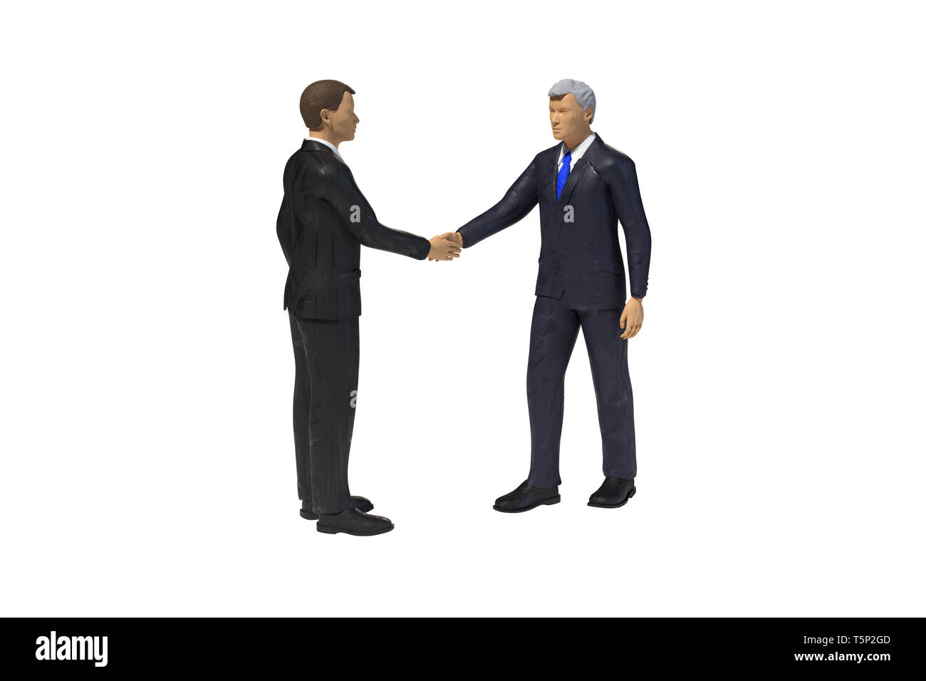 two toy miniature figure businessmen shaking hands, isolated on white background Stock Photo