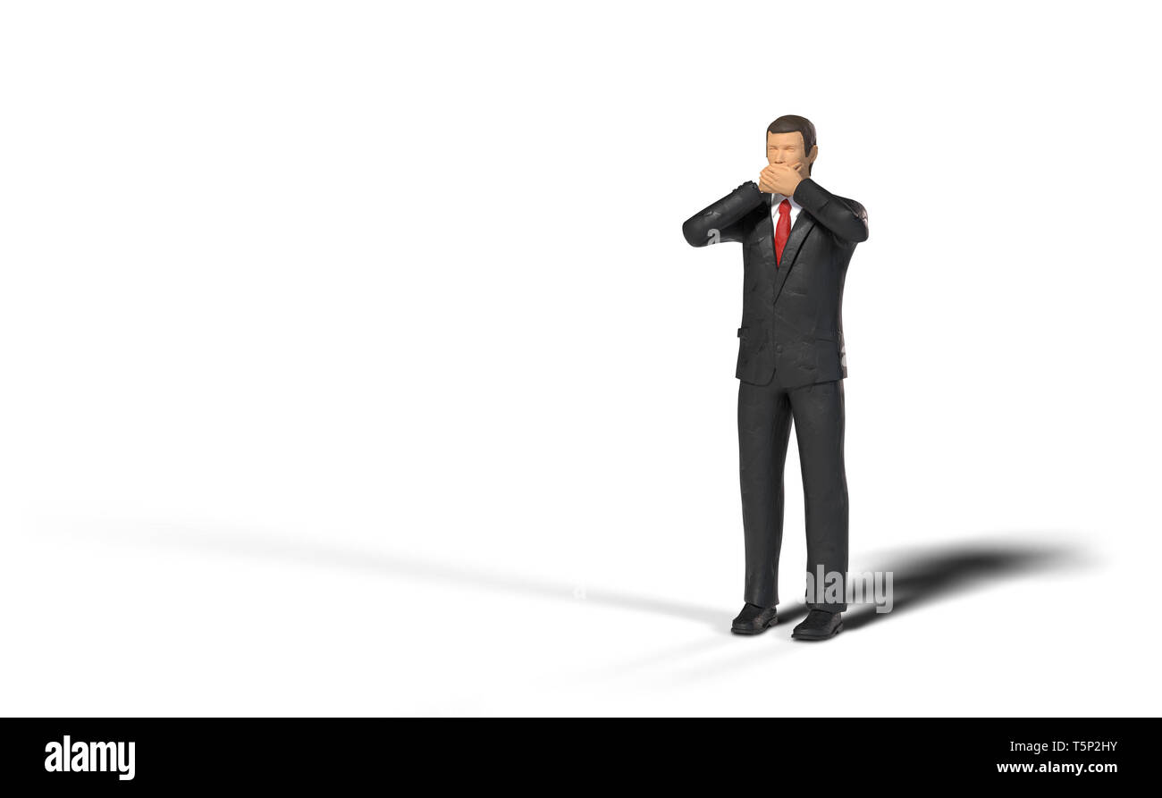 toy miniature businessman figure covering his mouth in front of an empty space, concept isolated with shadow on white background Stock Photo