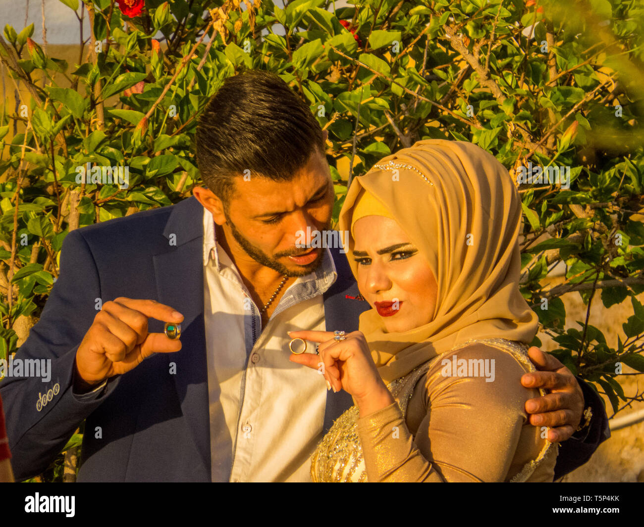 TYRE, LEBANON - MAY 21, 2017:  Unidentified Arabic couple posing for a photographer on their wedding day. Stock Photo