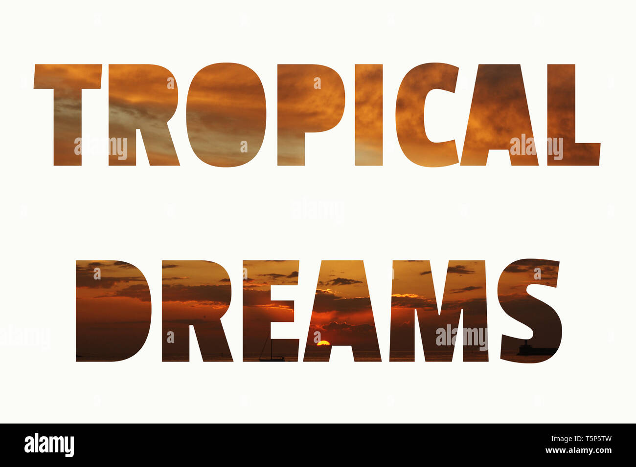 Tropical Dreams lettering. Tropical sunset vivid orange brown and coral sky background Stock Photo