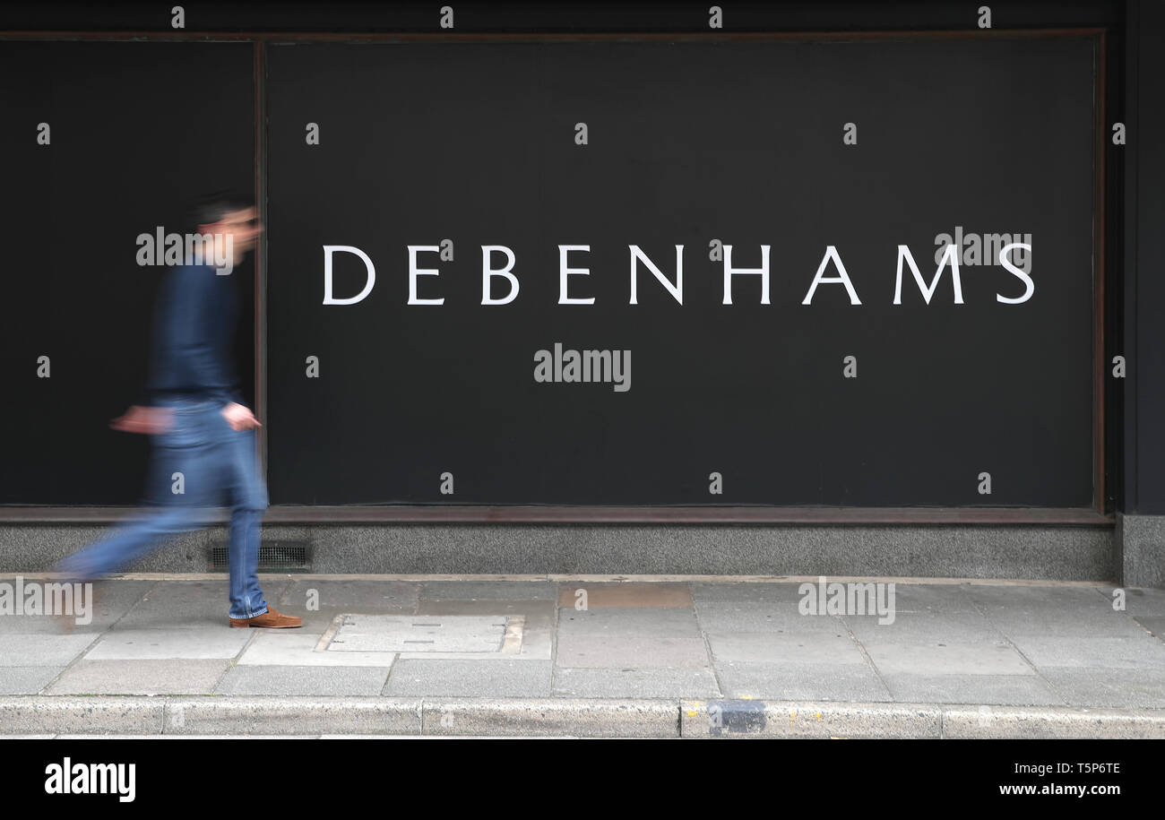 A person walks past a Debenhams department store in Southsea, Hampshire, which has been named as one of 22 stores to be closed, putting 1,200 jobs at risk across the department store chain. Stock Photo