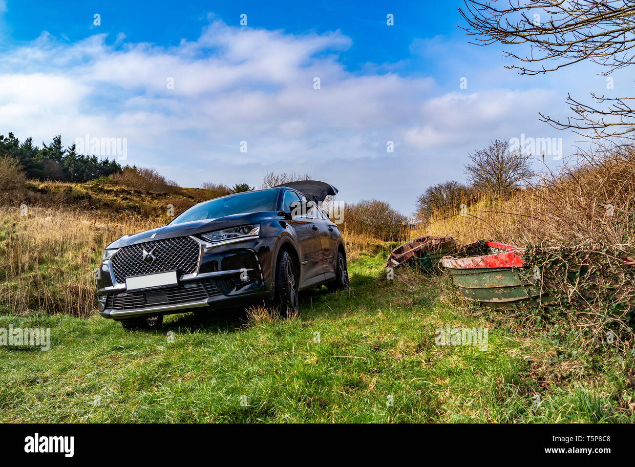 PORTNOO, DONEGAL / IRELAND - FEBRUARY 27 2019 : DS 7 Crossback Rivoli standing in the wilderness next to boat. Stock Photo