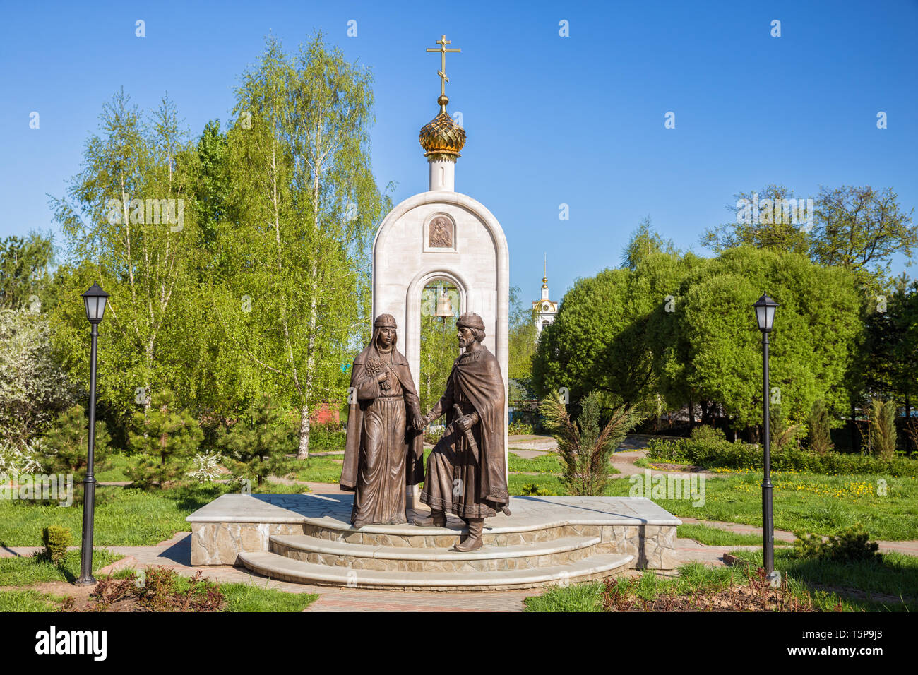 DMITROV, RUSSIA - MAY 10, 2018: Monument to Russian saints Peter and Fevronia in Dmitrov was installed in 2015 sculptor Y. Khmelevskoy. Saints Peter a Stock Photo