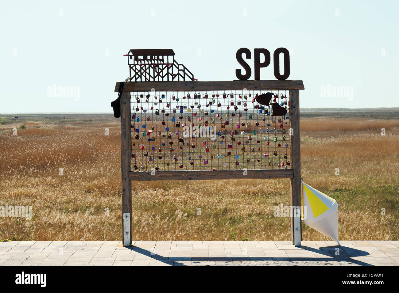 Sankt Peter Ording, Germany - April 20, 2019: Love locks at the beach. SPO is short for St. Peter-Ording. Stock Photo