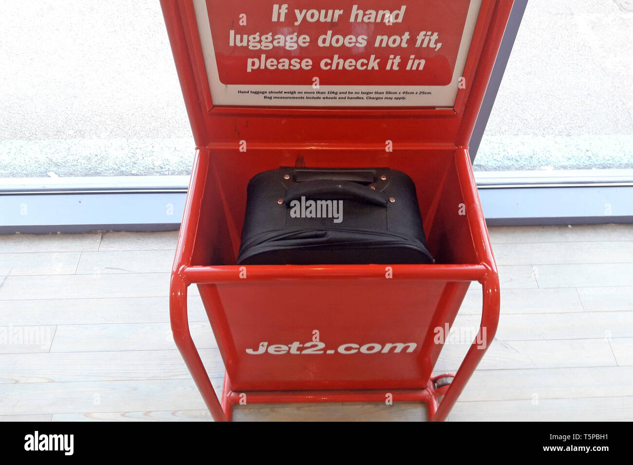 Jet2.com Jet 2 hand luggage bag frame size tester at East Midlands airport in Leicestershire, UK. April 13, 2019. Stock Photo