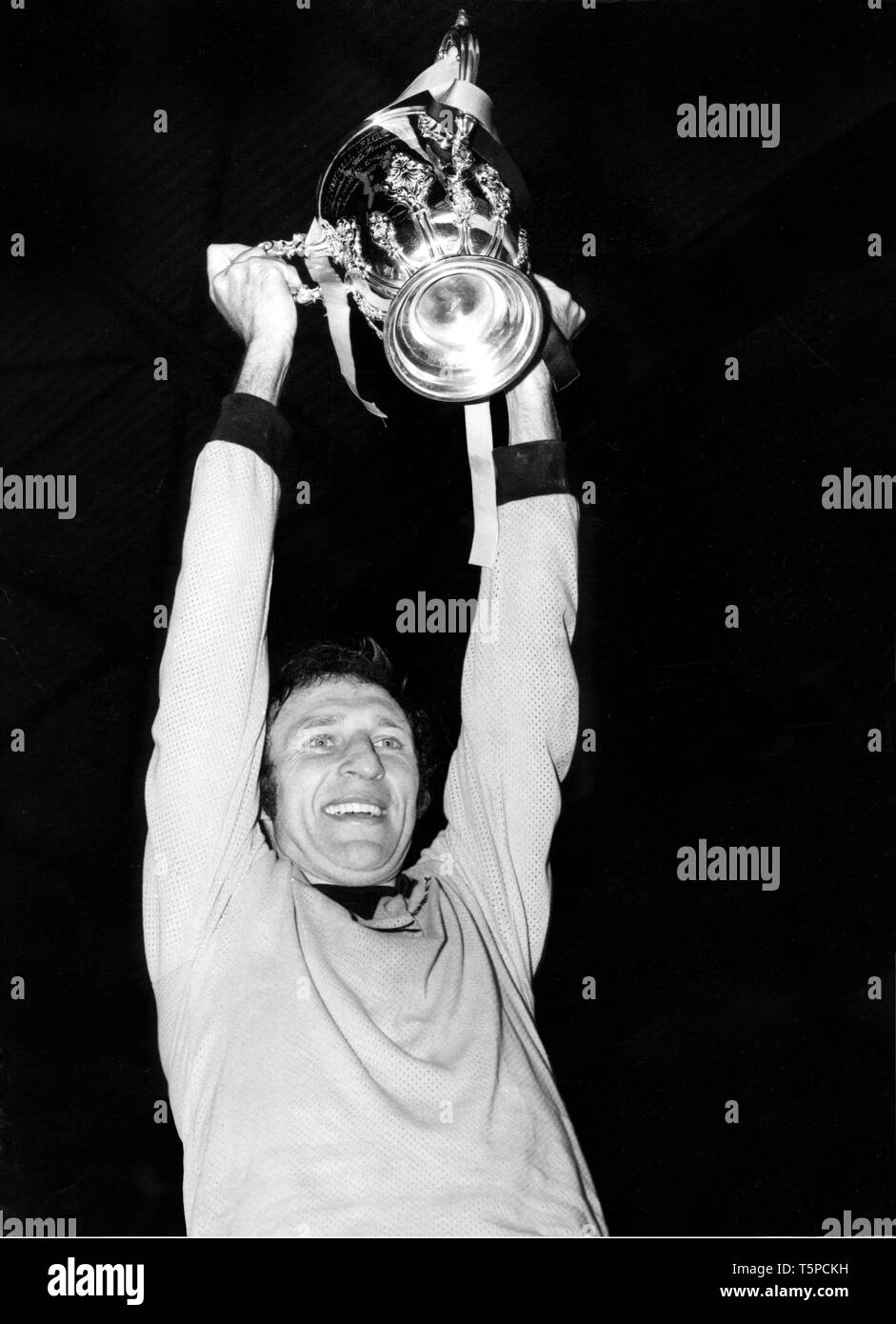 Wolverhampton Wanderers FC captain Mike Bailey holds the League Cup after beating Manchester City at Wembley in 1974 Stock Photo