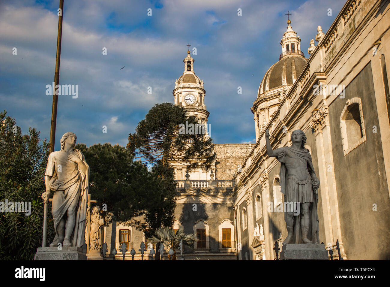 Catania cathedral detail, baroque architecture with statues and dome Stock Photo