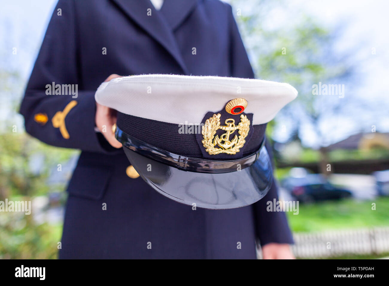 Woman in a german military uniform holds a marine hat Stock Photo - Alamy