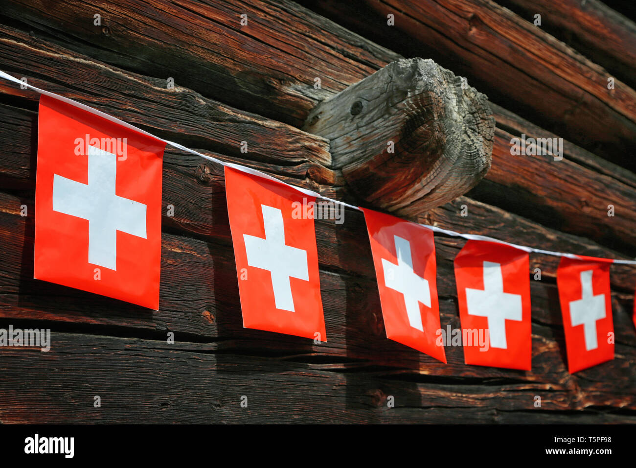 swiss flag pennant on Woodhouse Stock Photo