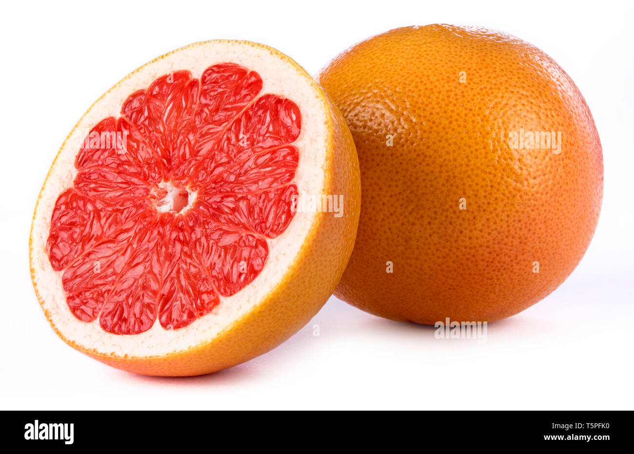 Red Grapefruit - Half And Whole Fruit on White Background Stock Photo