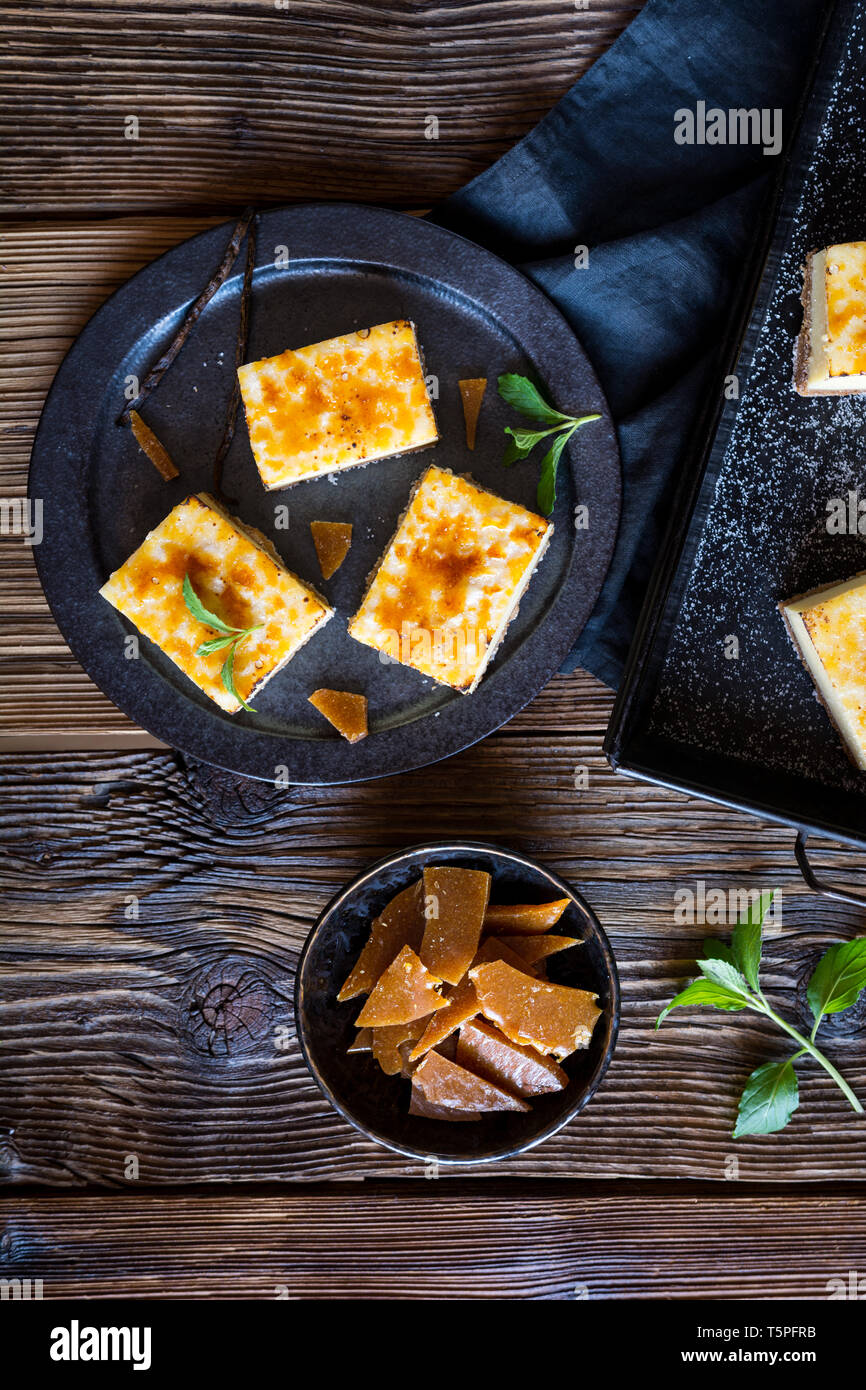 Homemade Creme Brulee cheesecake bars with cream cheese, crushed