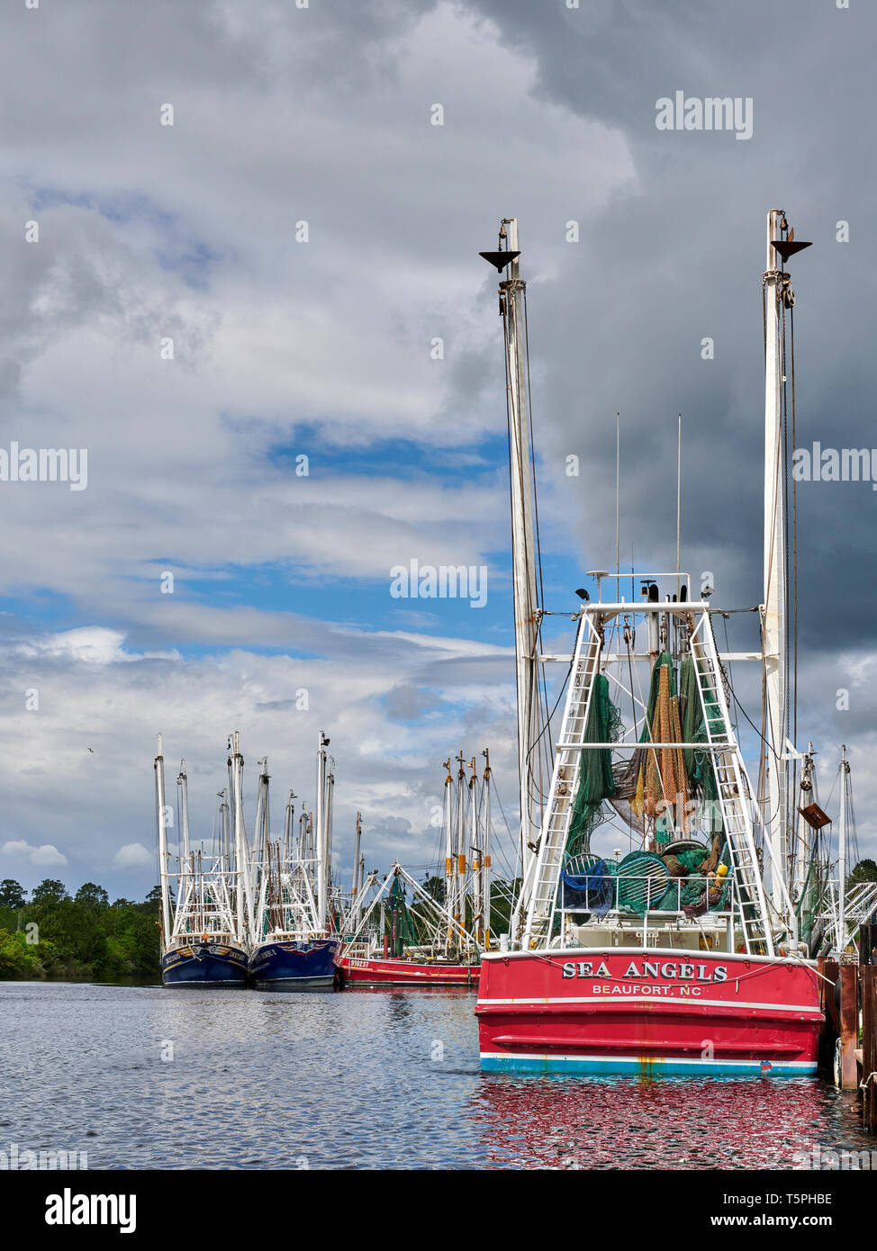 Commercial fishing boats and shrimp boats tied up, part of the fishing fleet, in Bayou La Batre Alabama, USA. Stock Photo