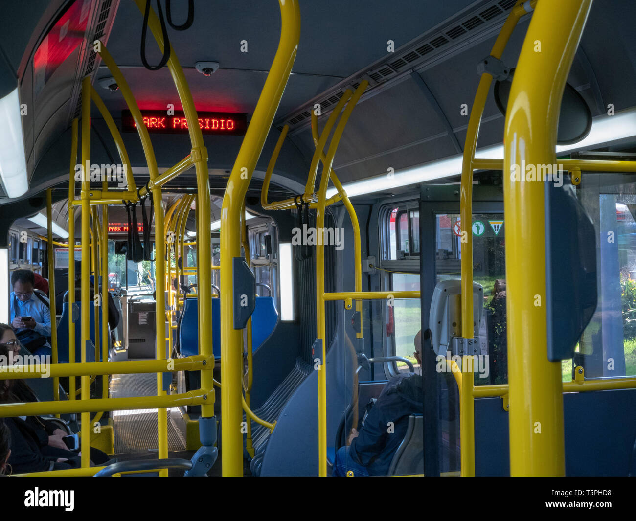 MUNI bus at Park Presidio bus stop during day Stock Photo