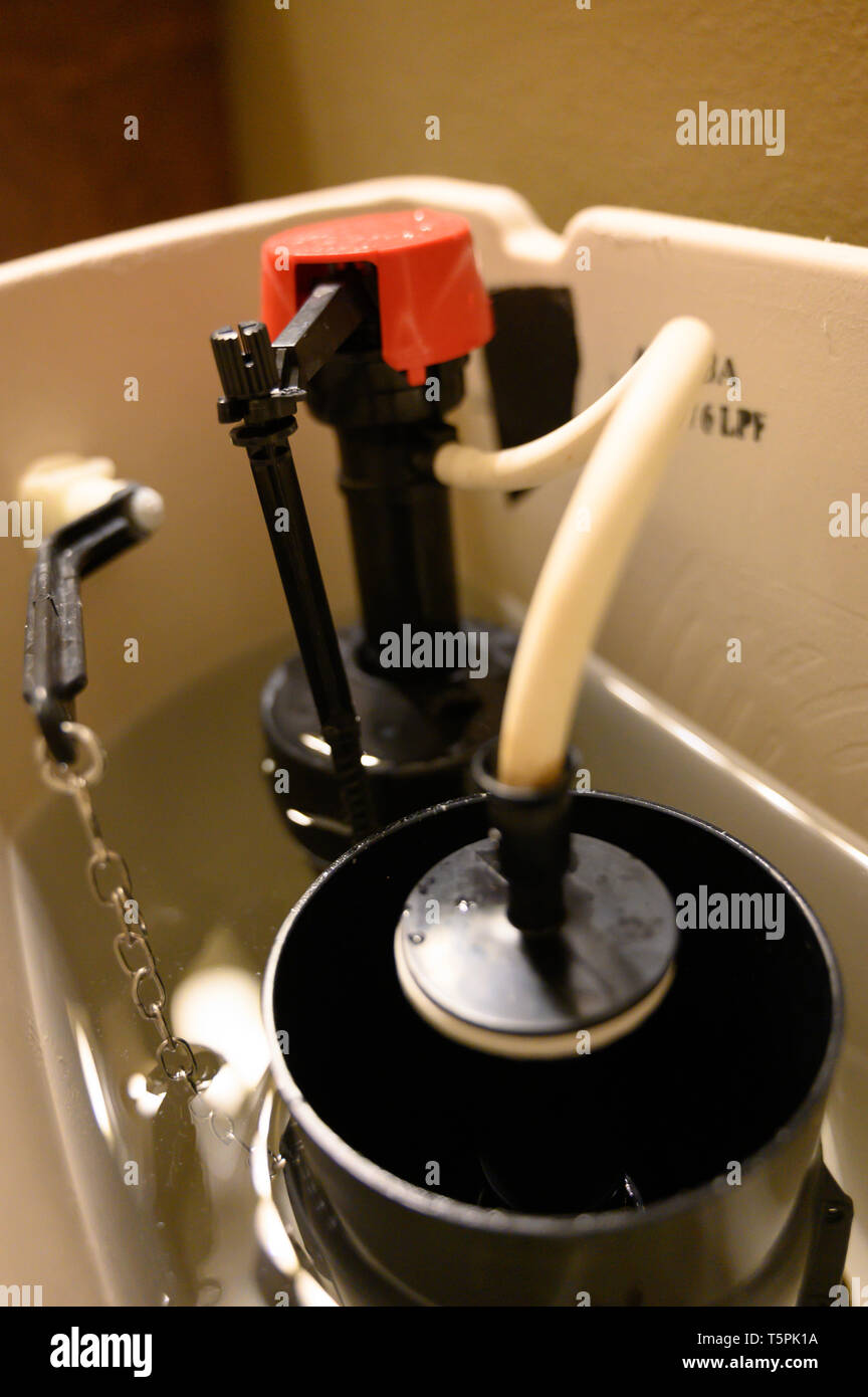 Inside water tank of toilet with float raised Stock Photo Alamy