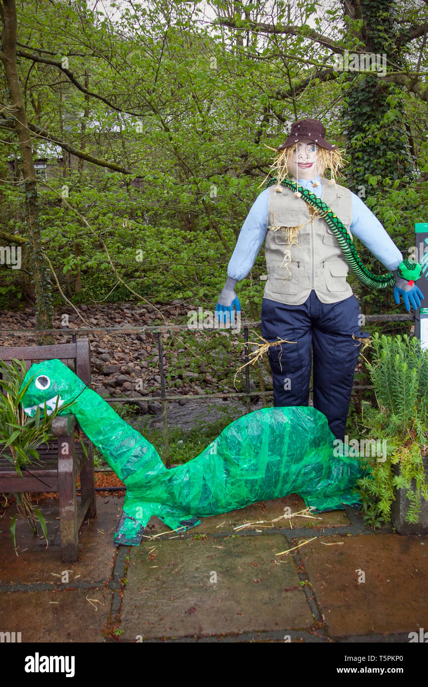 Wray, Lancaster. 26th April, 2019. Preparations underway at the Scarecrow Festival. The week long festival this year is themed on Extinction, Endangered, Extinct, & Climate change and involves local schools in the area who have created the figures as part of a educational project ideas, that cover a number of issues relating to the natural environment. Green Power. Rainwater Harvesting. Energy Conservation. Recycling. Pollution. Greenhouse effect. Climate change. Credit: MediaWorldImages/Alamy Live News Stock Photo