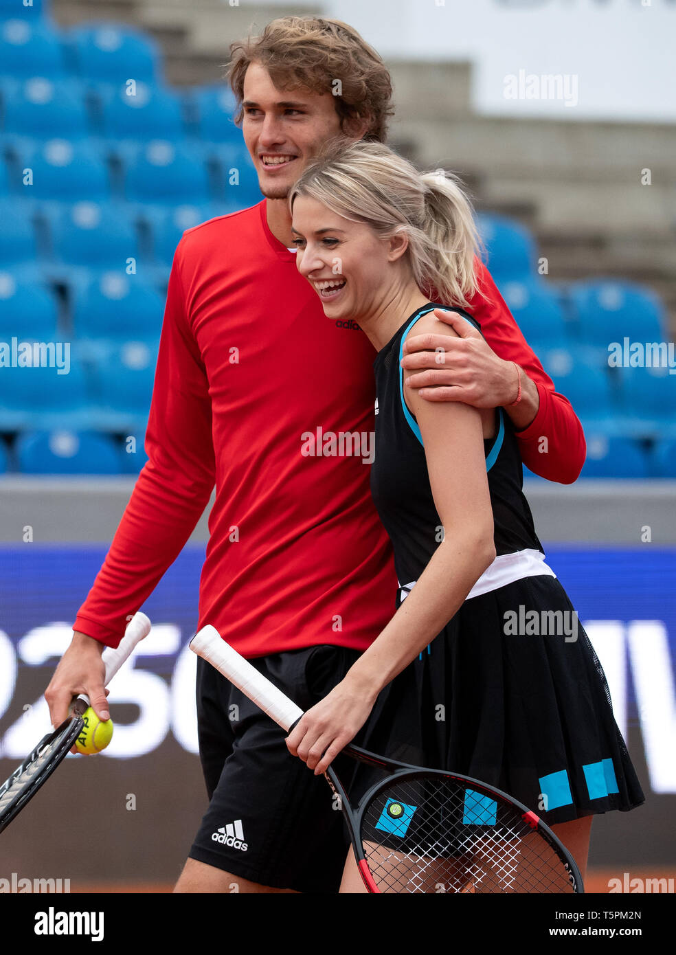 Munich, Germany. 26th Apr, 2019. Tennis: ATP-Tour: Alexander Zverev, German  tennis professional, and Lena Gercke, model and presenter, play tennis  together at a press conference. From 27.04. to 05.05.2019 the ATP tournament