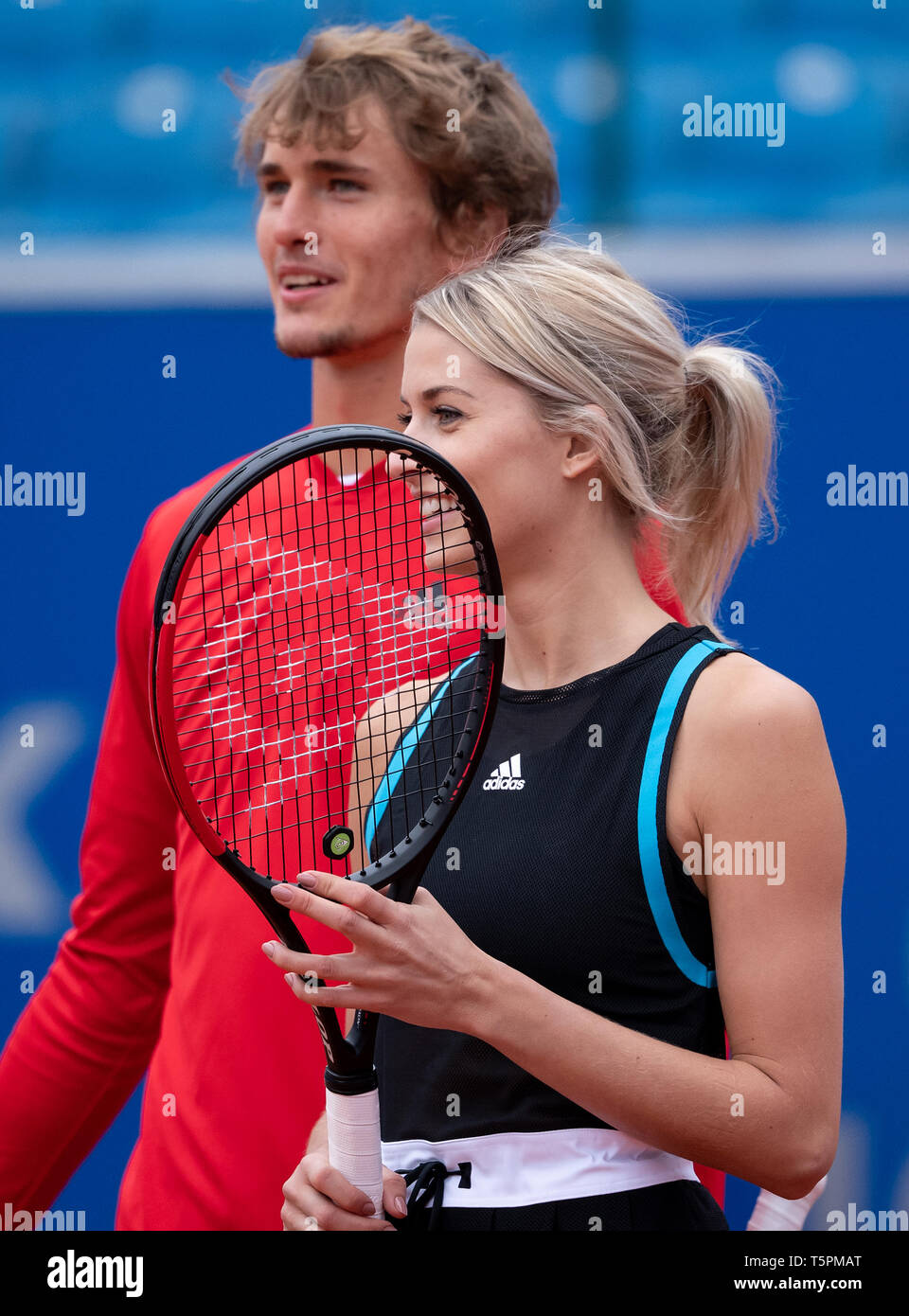 Munich, Germany. 26th Apr, 2019. Tennis: ATP-Tour: Alexander Zverev, German  tennis professional, and Lena Gercke, model and presenter, play tennis  together at a press conference. From 27.04. to 05.05.2019 the ATP tournament