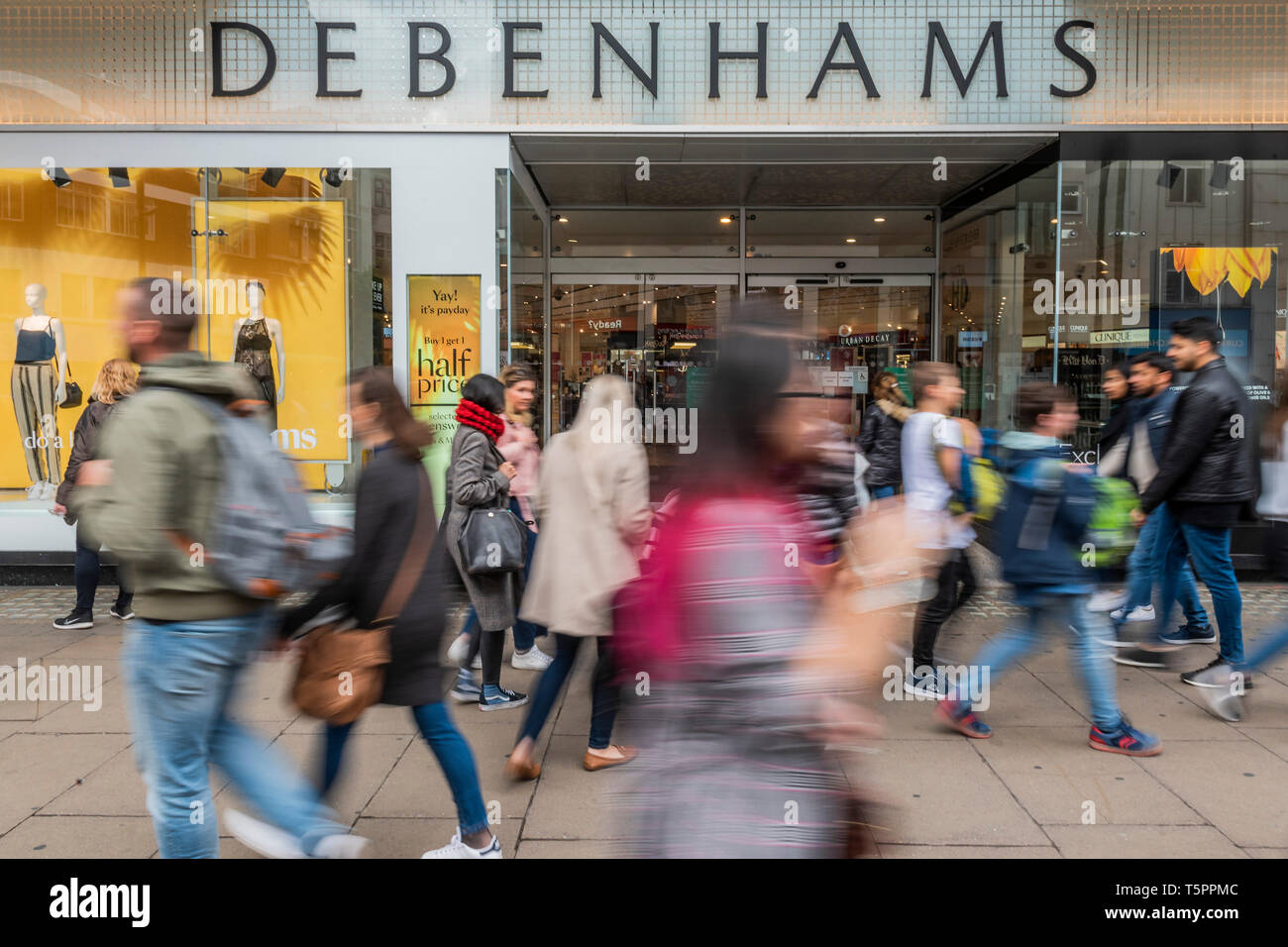 London, UK. 26th Apr 2019. Consumers pass by Debenhams Oxford Street. Debenhams names 22 store it will close by 2020. It seems its flagship store on Oxford Street is not one of them. Credit: Guy Bell/Alamy Live News Stock Photo