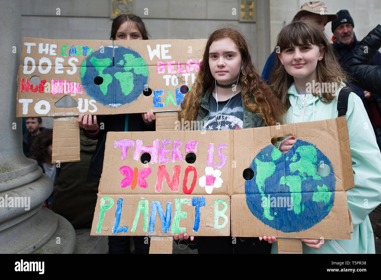 Manchester, UK. 26th Apr, 2019. Young activists seen with climate change placards during the weekly Extinction Rebellion protest outside Manchester Central Library.Extinction Rebellion is a socio-political movement which uses nonviolent resistance to protest against climate breakdown, biodiversity loss, and the risk of human extinction and ecological collapse. Credit: Steven Speed/SOPA Images/ZUMA Wire/Alamy Live News Stock Photo