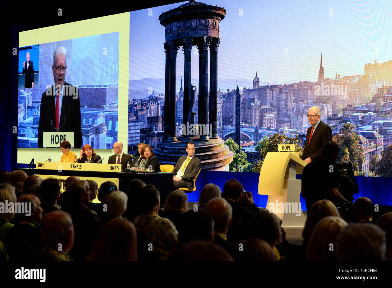 Edinburgh, Scotland, United Kingdom. 27th Apr, 2019. Scottish Cabinet Secretary for Constitutional Relations Mike Russell waits in the wings prepares to open the Scottish National Party's Spring Conference in the Edinburgh International Conference Centre. Credit: Ken Jack/Alamy Live News Stock Photo