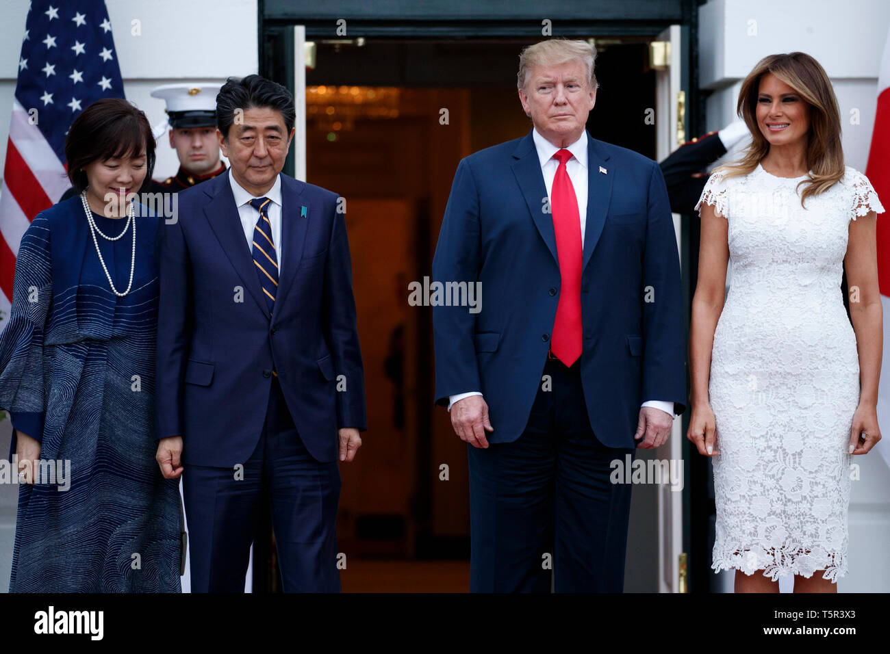 US President Donald J. Trump (2-R) and First Lady Melania Trump (R) greet  Japanese Prime Minister Shinzo Abe (L) and First Lady Akie Abe (2-L) at the  South Portico of the White