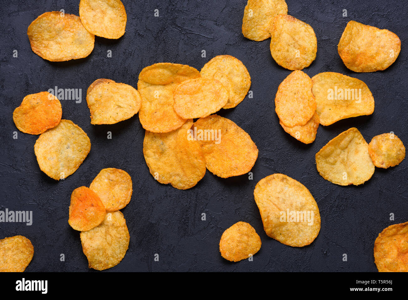 Potato chips on dark background Stock Photo Alamy