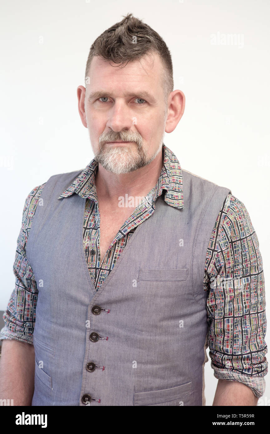 Portrait Of Handsome Grey Haired Man In His 50s Stock Photo