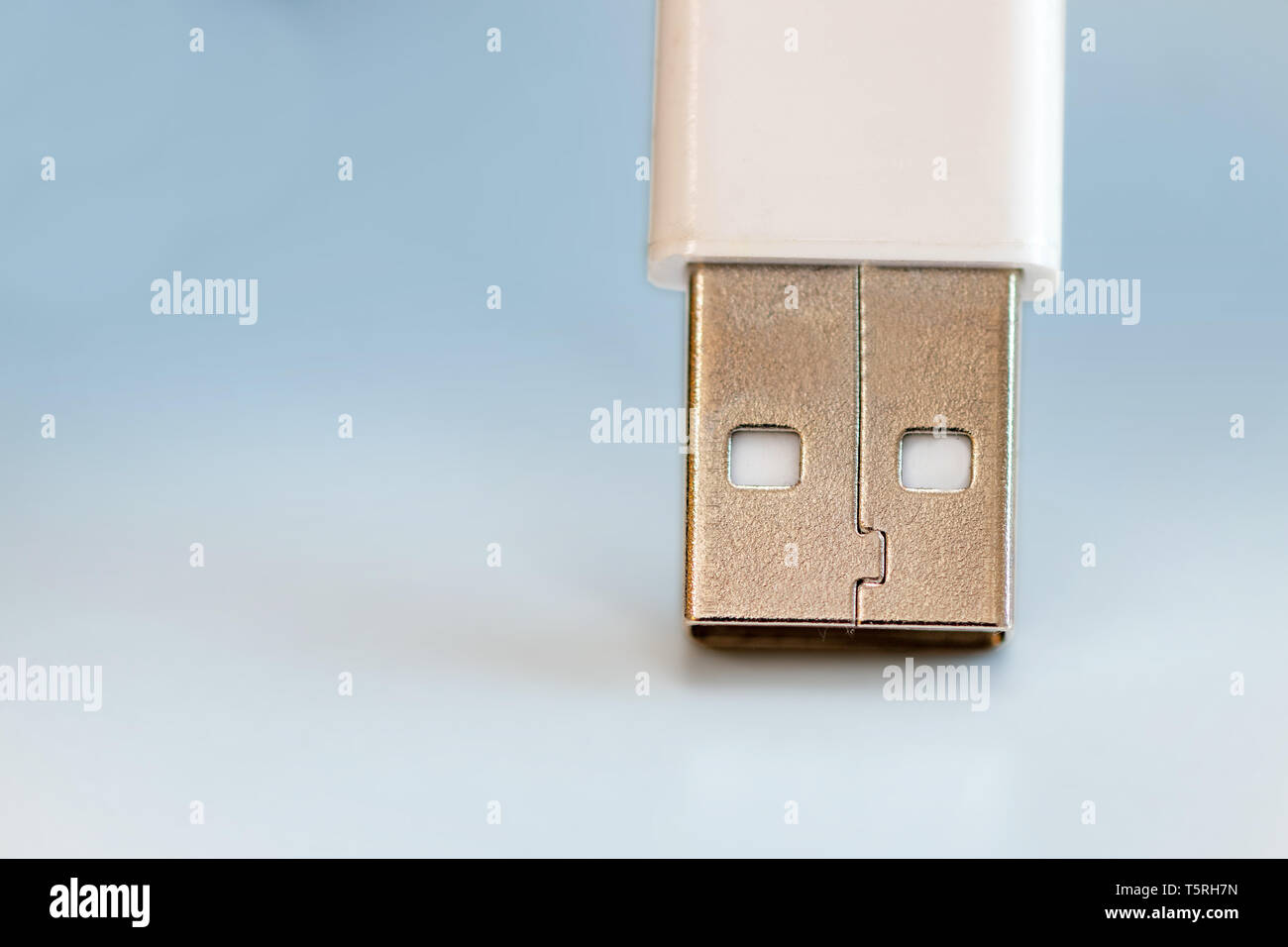 happy usb cable with face isolated on blue background Stock Photo