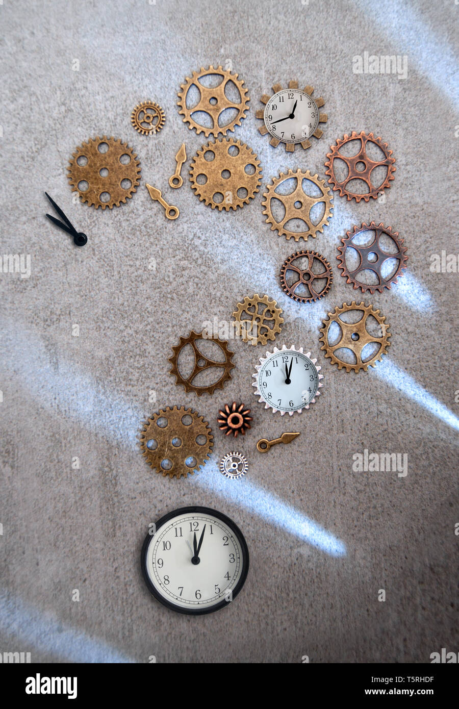 Clock parts including hands gears and cogs in the shape of a question