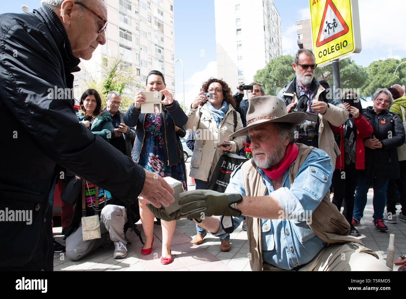 Madrid, Spain. 26th April, 2019. Gunter Demnig receiving the Stolperstein remembering Eufemio Garcia Garcia for its installation. Stock Photo