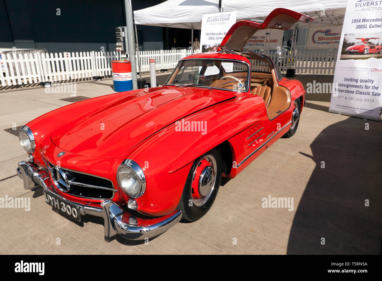 Three-quarter front view of a beautiful red 1954 Mercedes-Benz  300SL Gullwing  which will be for sale in the 2029 Silverstone Classic Car Auction Stock Photo