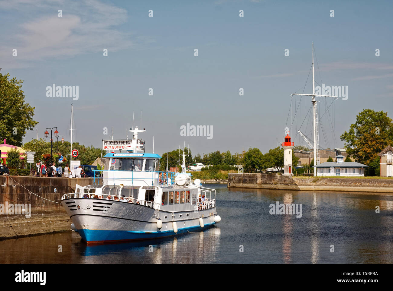 tour boat, people, sightseeing, vacation, lighthouse, water scene, Normandy; Europe, Honfleur; France; summer, horizontal Stock Photo