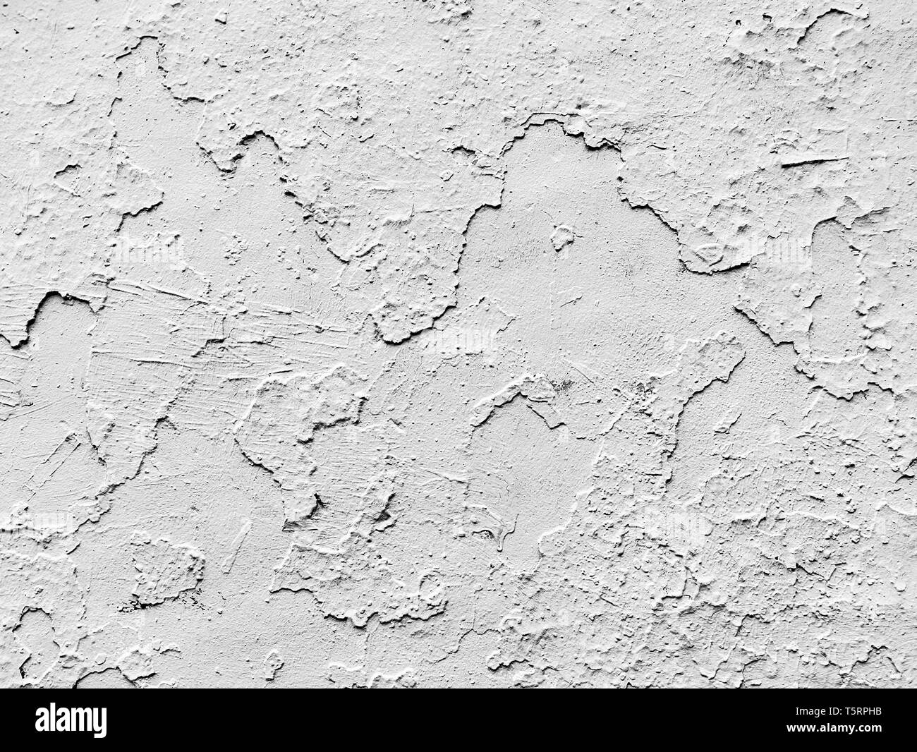 background of white wall cracked and peeled Stock Photo