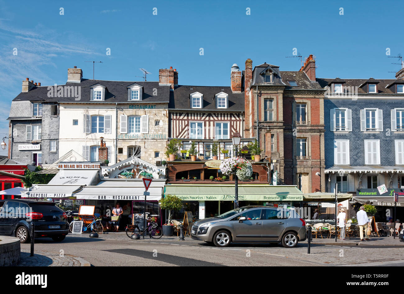 city scape, street scene, old buildings, restaurants, cars, people ...