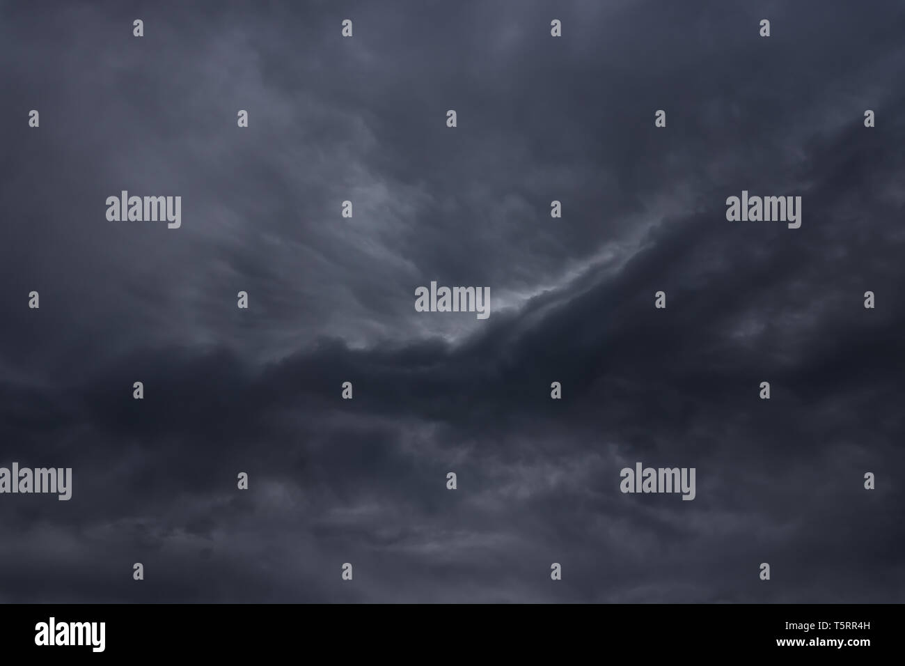 cloudscape background with dark stormy clouds Stock Photo - Alamy