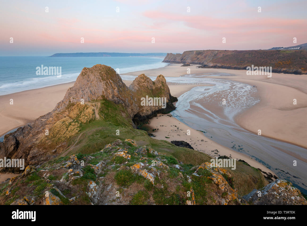 Three Cliffs Bay at sunrise at high tide, Gower Peninsula, Swansea, West Glamorgan, Wales, United Kingdom, Europe Stock Photo