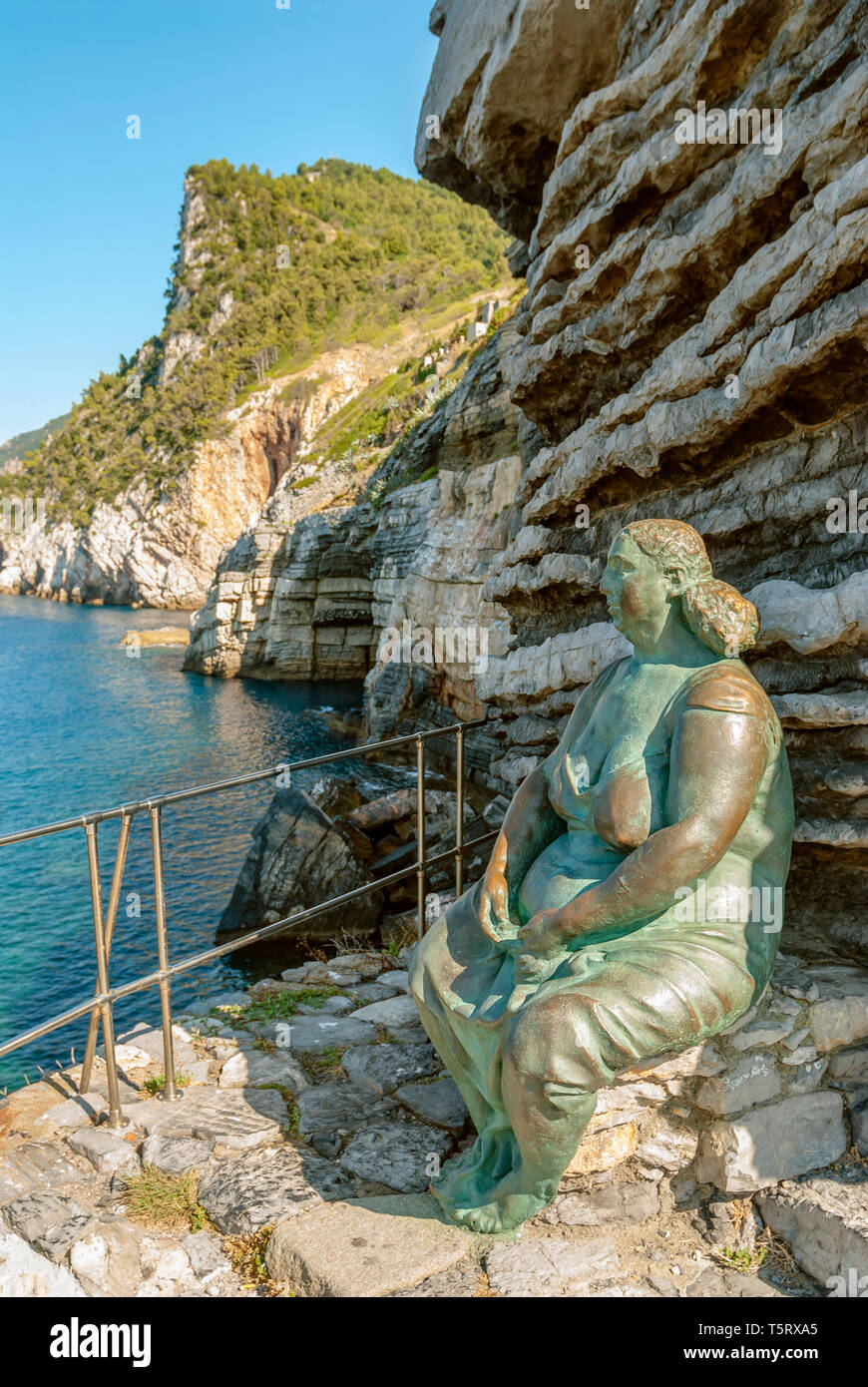Bronze sculpture 'Mother Earth' by Scorzelli above the Byron Cave at the coastline of Porto Venere, Cinque Terre National Park, Liguria, Italy Stock Photo