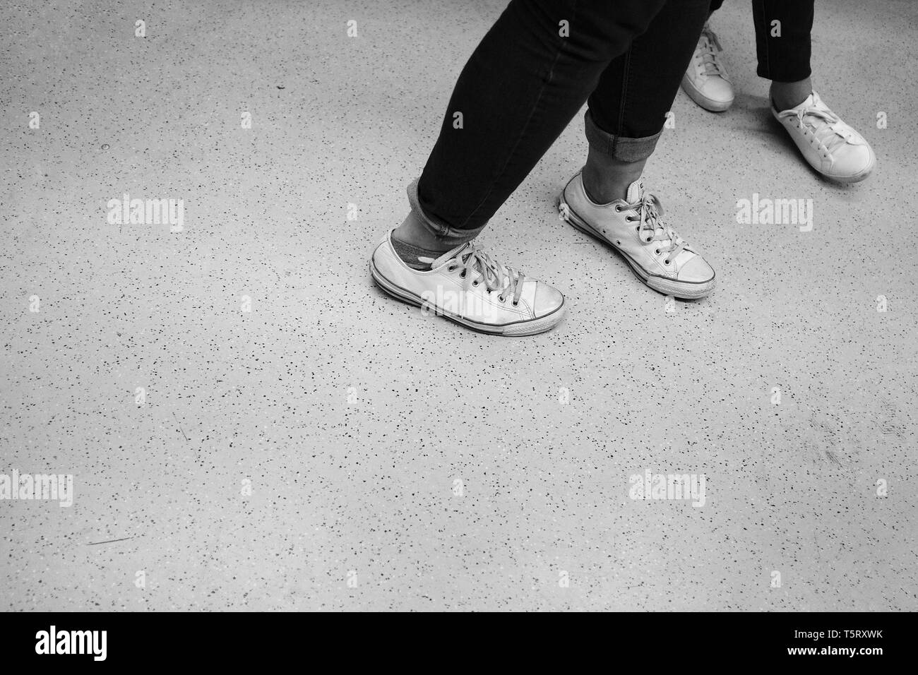 Feet of two dancers in white shoes Stock Photo Alamy