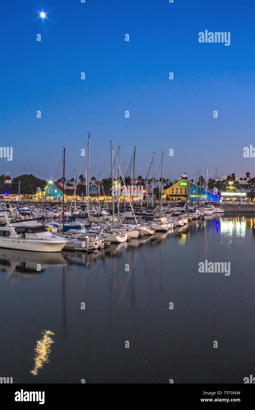 Moonlight over Shoreline Village harbor in Long Beach, California Stock Photo