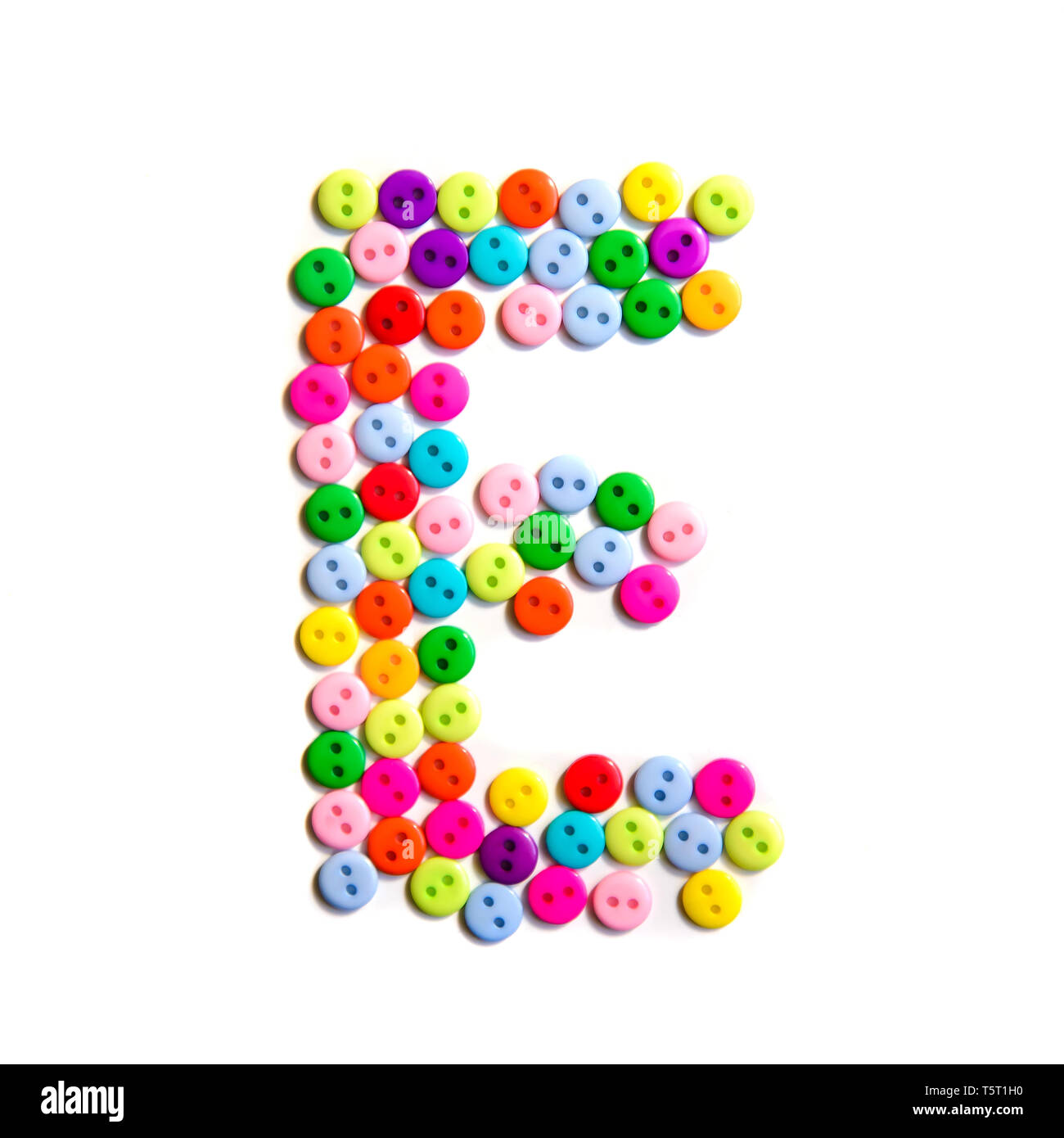 Letter E of the English alphabet from a group of colorful small buttons on a white background Stock Photo