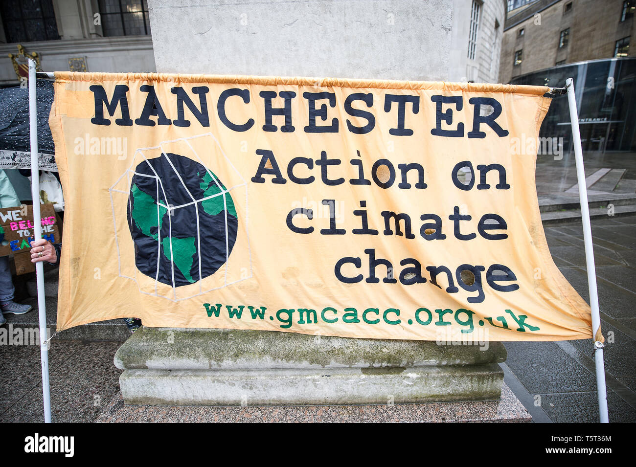 Manchester Action on Climate Change banner seen during the weekly Extinction Rebellion protest outside Manchester Central Library. Extinction Rebellion is a socio-political movement which uses nonviolent resistance to protest against climate breakdown, biodiversity loss, and the risk of human extinction and ecological collapse. Stock Photo