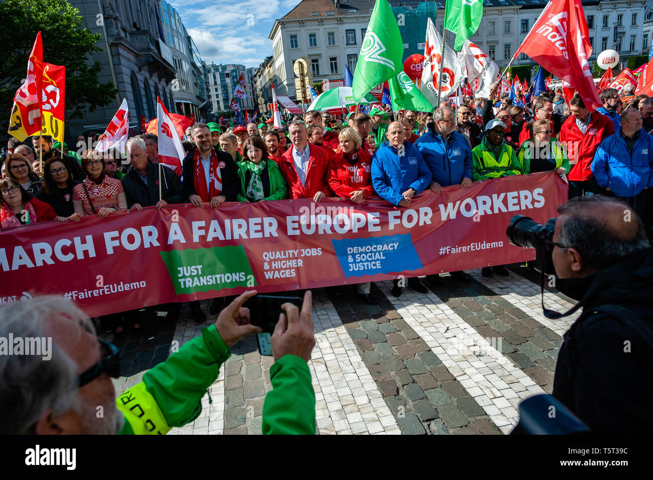 Workers Seen Holding A Banner And Flags During The Demonstration